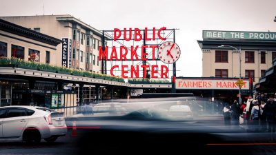 a car driving on Pike Place Market street