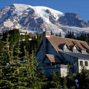 a house with a mountain in the background