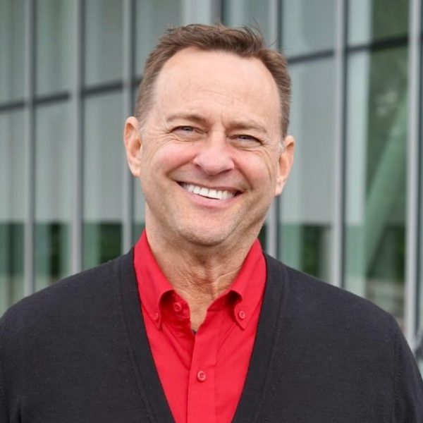 a man standing in front of a building