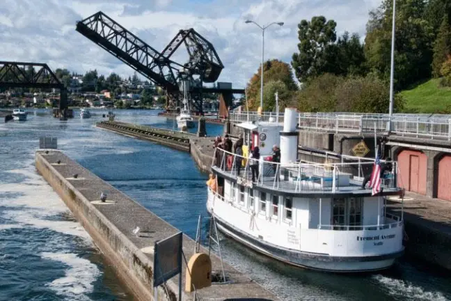a boat is docked next to a body of water
