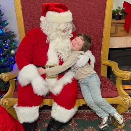 a group of stuffed animals sitting next to a teddy bear