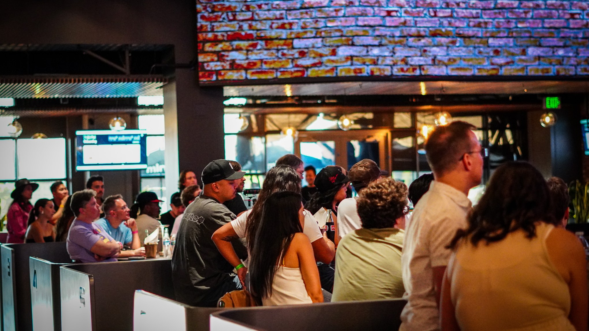 a group of people sitting at a bar
